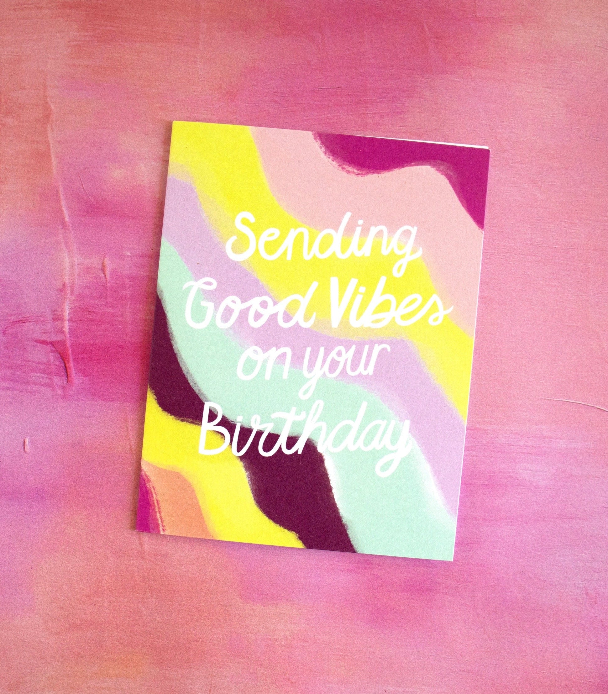 Colorful card with 'Sending Good Vibes on your Birthday' text on a pink textured background