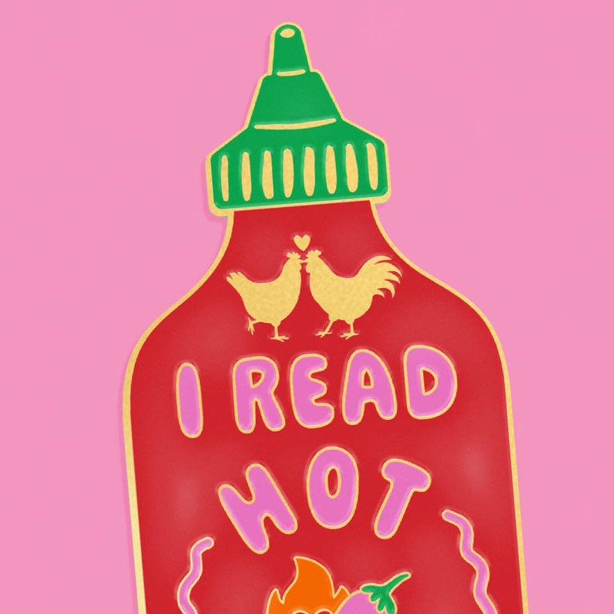 Hot sauce bottle with text 'I Read Hot Shit extra spicy' on a pink background with red peppers.