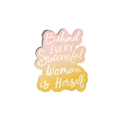 Motivational quote 'Behind every successful woman is herself' with gradient colors on a white background