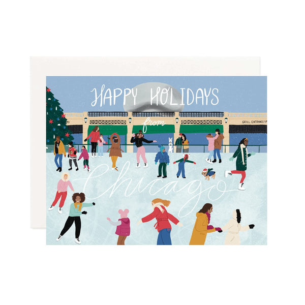 A horizontal card with a Chicago Cityscape, an outdoor ice skating rink with people smiling and ice skating. Scene is against a blue background with the Chicago Bean statue, bridge, shops and a large Christmas tree. Hand lettered Happy Holidays from Chicago.