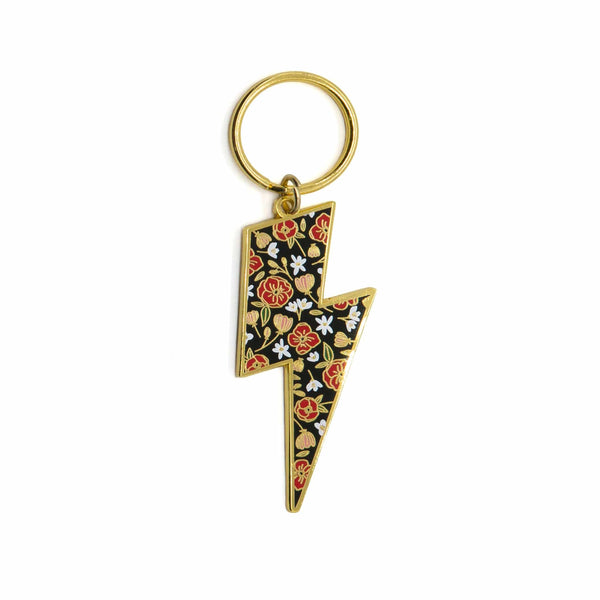 Lightening Bolt Keychain with a black, red, white & green floral pattern. White lillies for Harry's Mom, Red poppies, pink flowers and green leaves throughout.